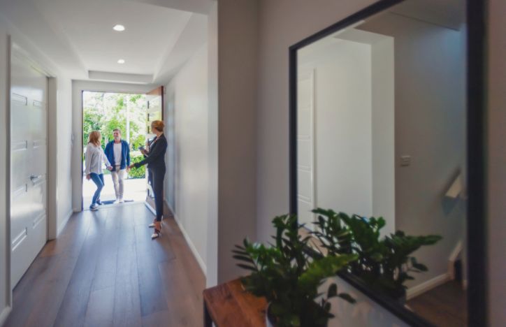 Couple Being Shown Around A Property