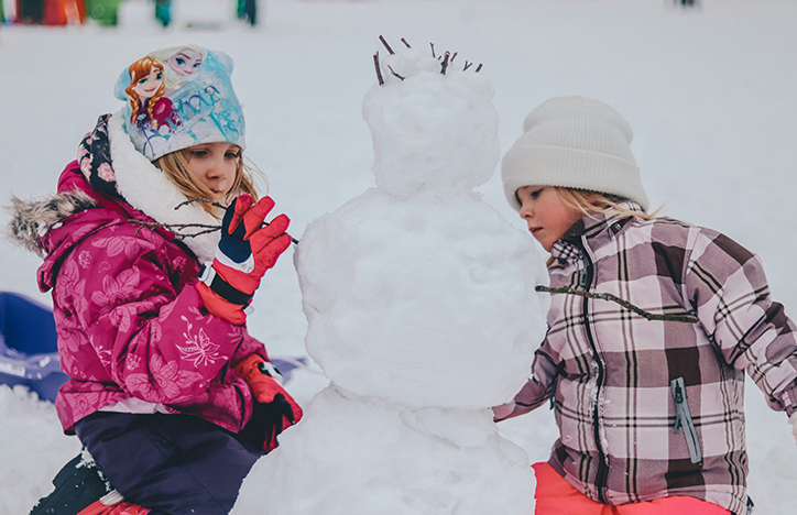 Children Building A Snowman