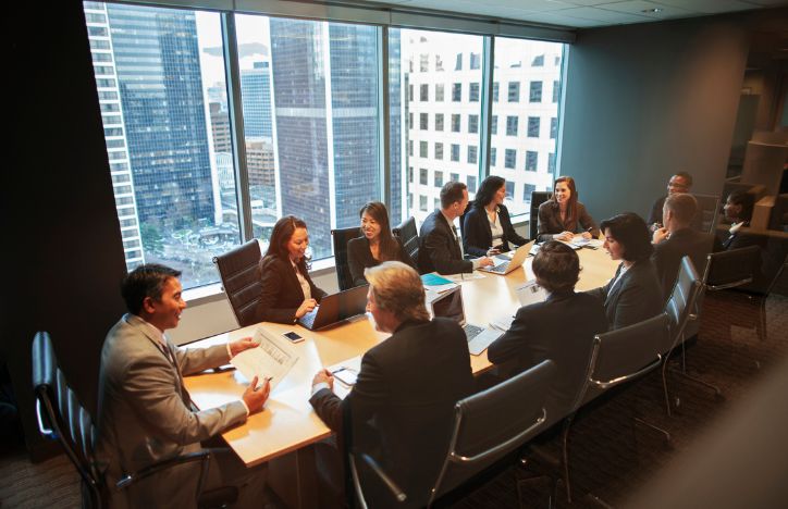 Meeting In A Boardroom With Urban Landscape
