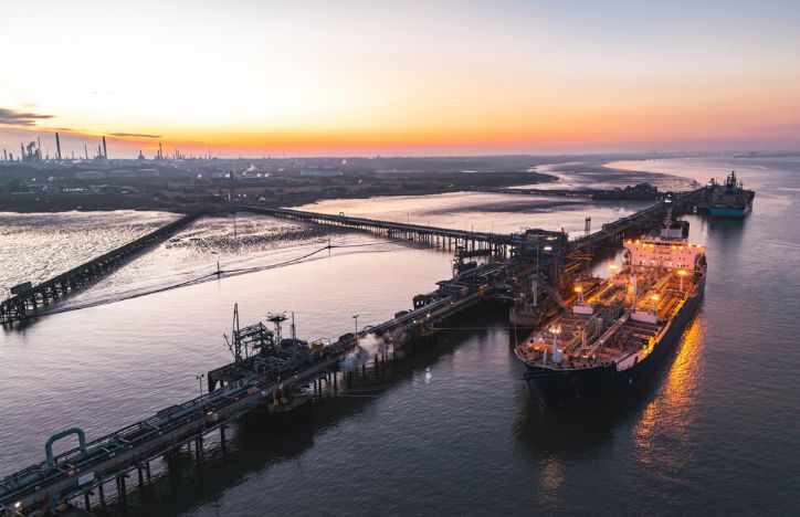 Oil Tanker Moored At Fawley Refinery At Sunset, Southampton, Uk